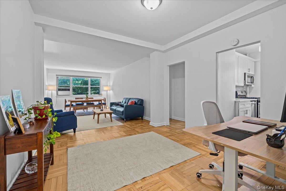 235 Garth Road, Unit A1F Scarsdale, NY 10583 - Photo 1 of 1 a bed room with a bed and a table