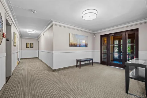 a view of a livingroom with furniture and staircase