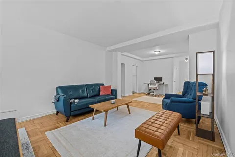 a living room with furniture and a piano