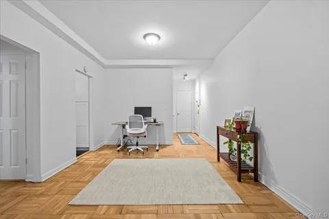 a bed room with a bed and a chair