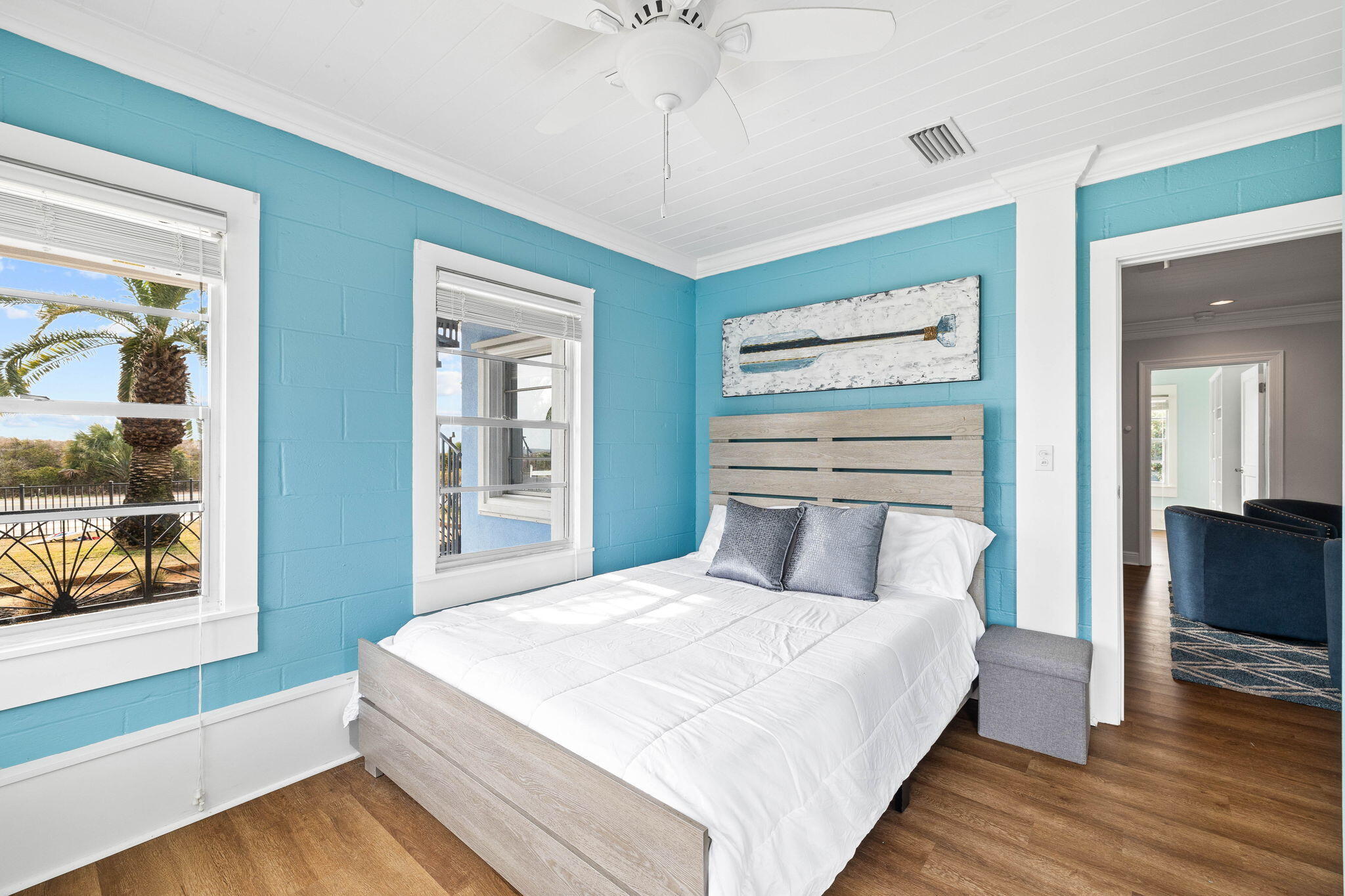 20816 Front Beach Road Panama City Beach, FL 32413 - Photo 25 of 68 a bedroom with a large bed and a chandelier