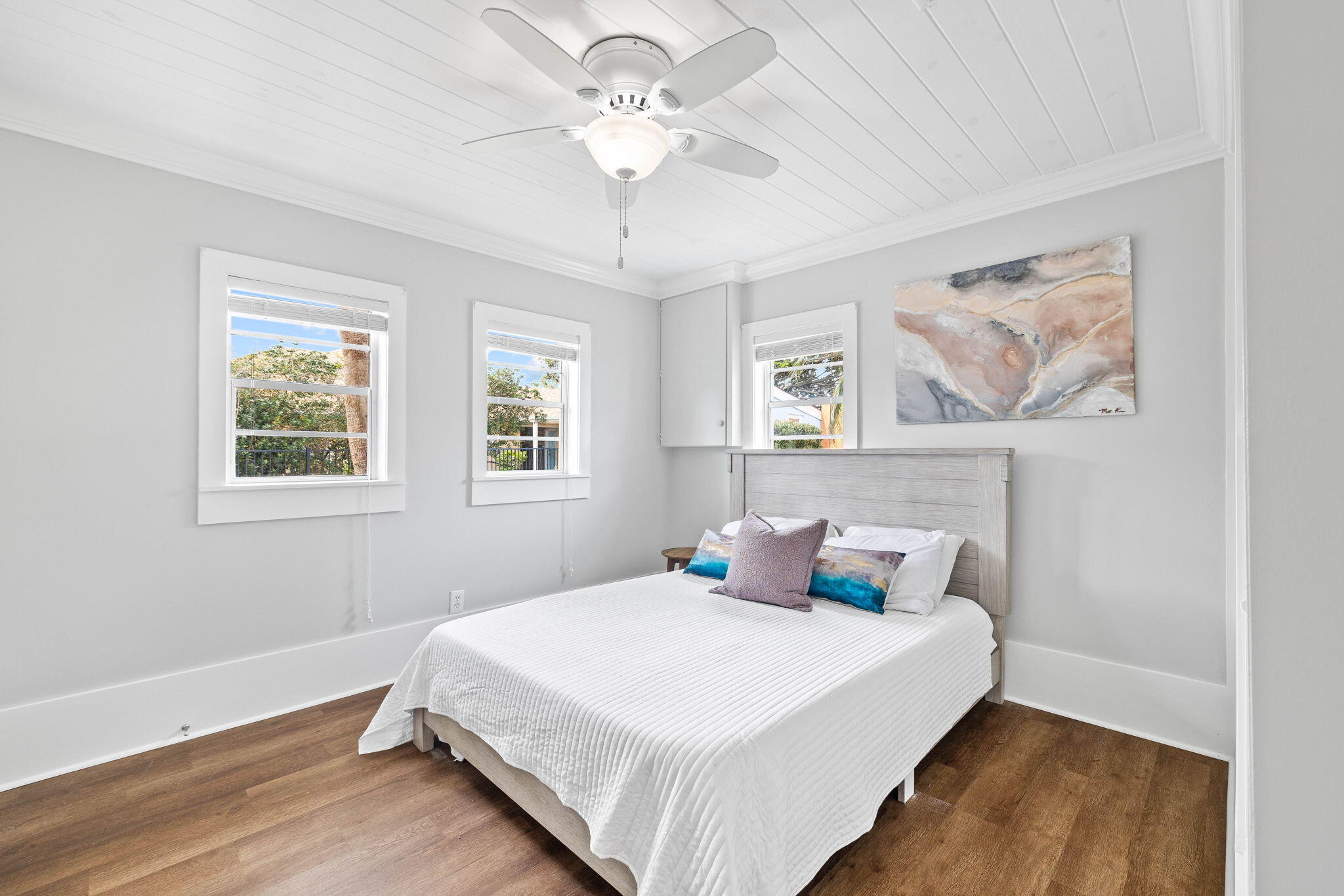 20816 Front Beach Road Panama City Beach, FL 32413 - Photo 32 of 68 a bedroom with a large bed and a chandelier
