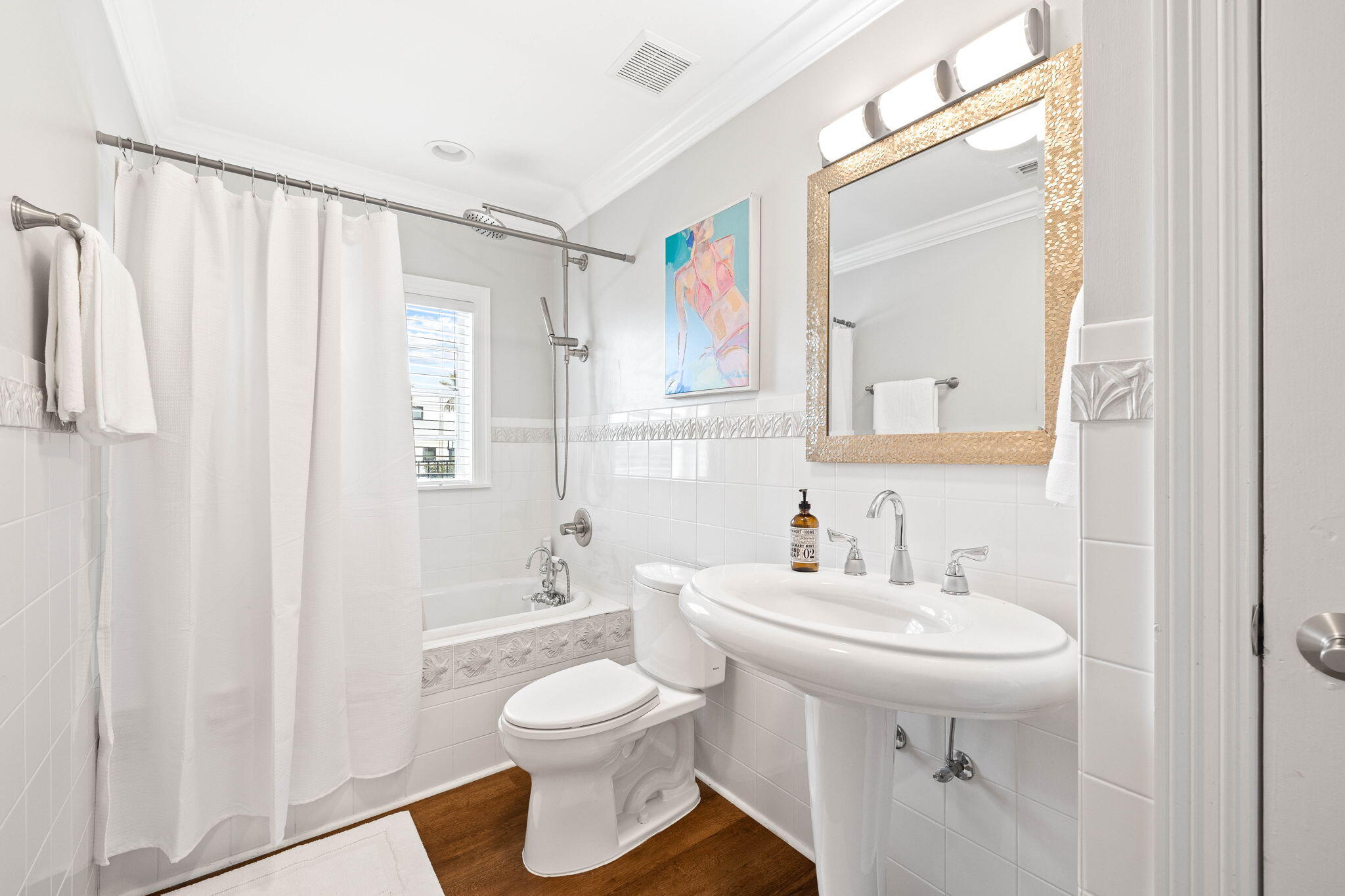 20816 Front Beach Road Panama City Beach, FL 32413 - Photo 35 of 68 a bathroom with a sink a toilet and shower curtain