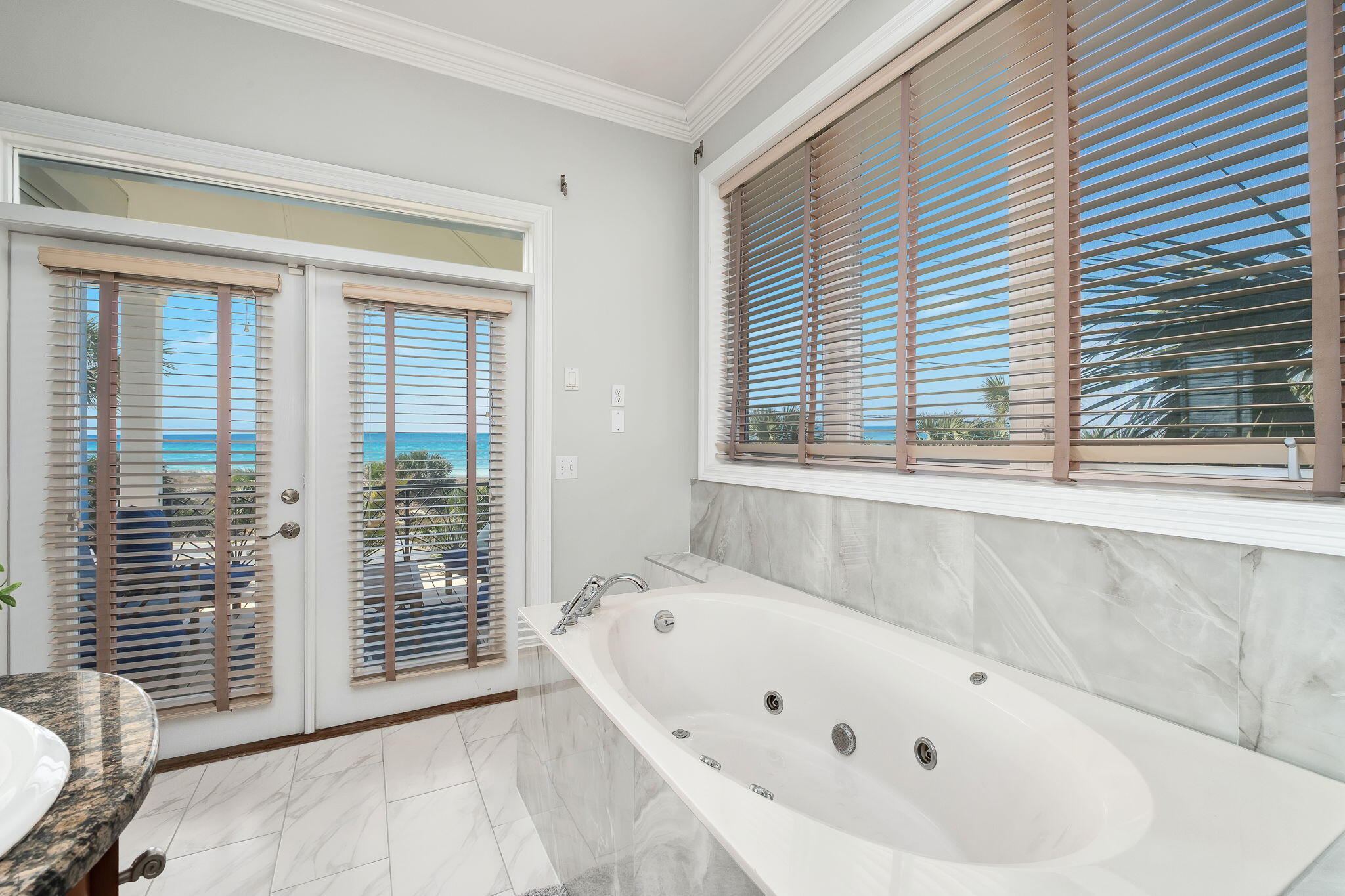 20816 Front Beach Road Panama City Beach, FL 32413 - Photo 47 of 68 a bathroom with a bathtub and window