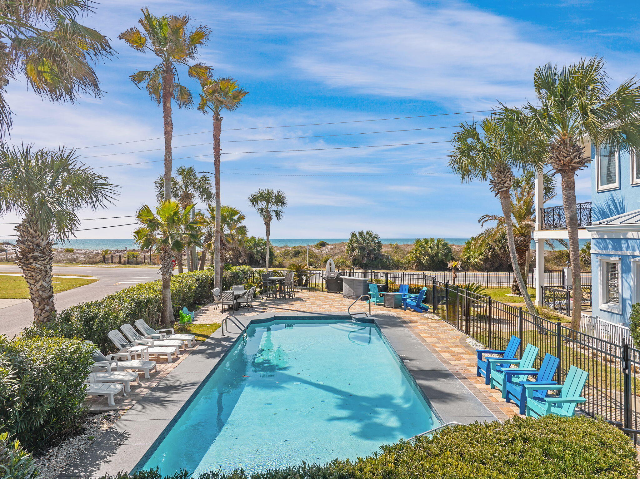 20816 Front Beach Road Panama City Beach, FL 32413 - Photo 58 of 68 a view of a swimming pool with a patio and a garden