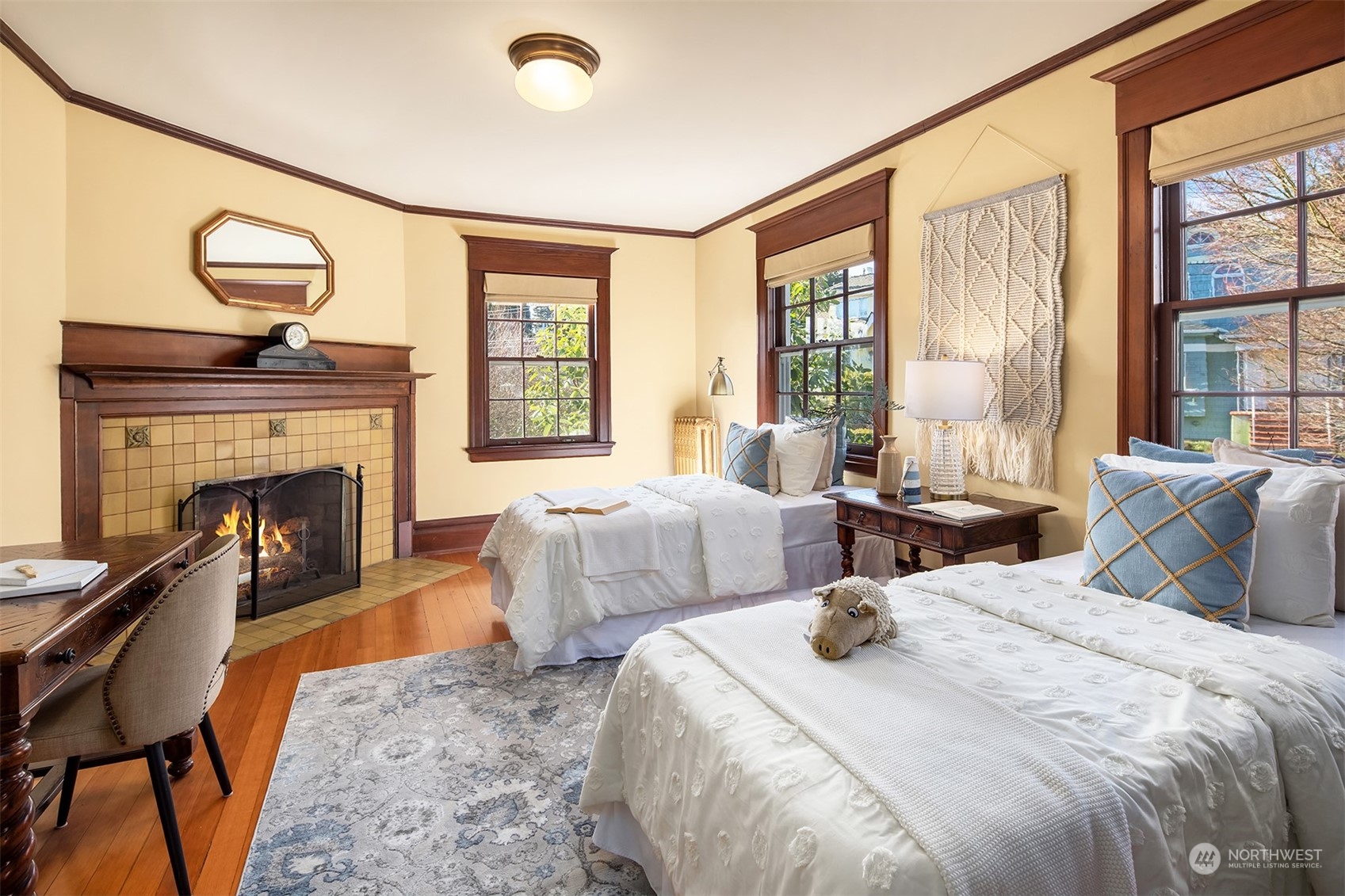 3708 42nd Avenue South Seattle, WA 98144 - Photo 21 of 40 a bedroom with two beds and a fireplace