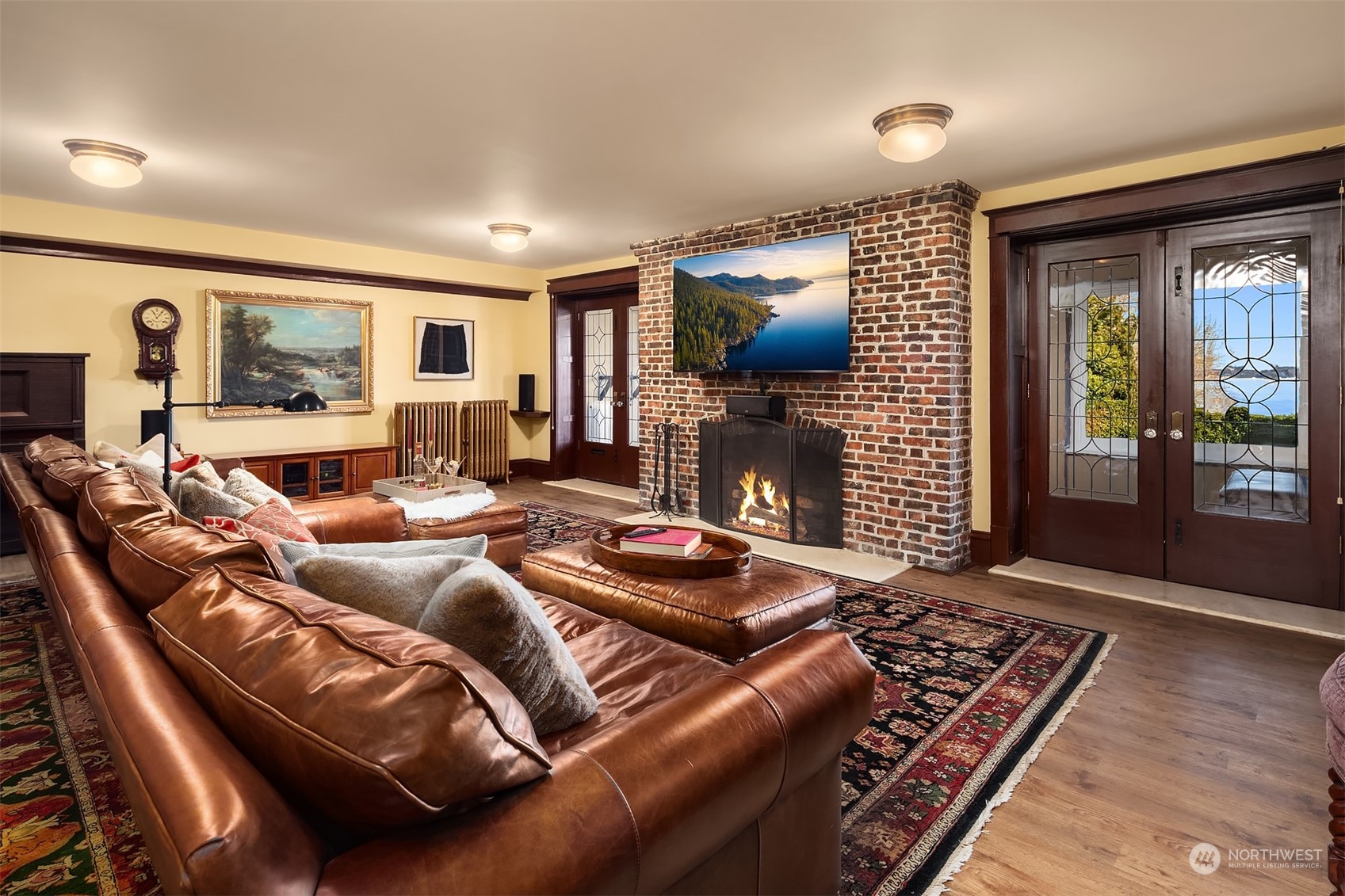 3708 42nd Avenue South Seattle, WA 98144 - Photo 24 of 40 a living room with furniture a flat screen tv and a fireplace