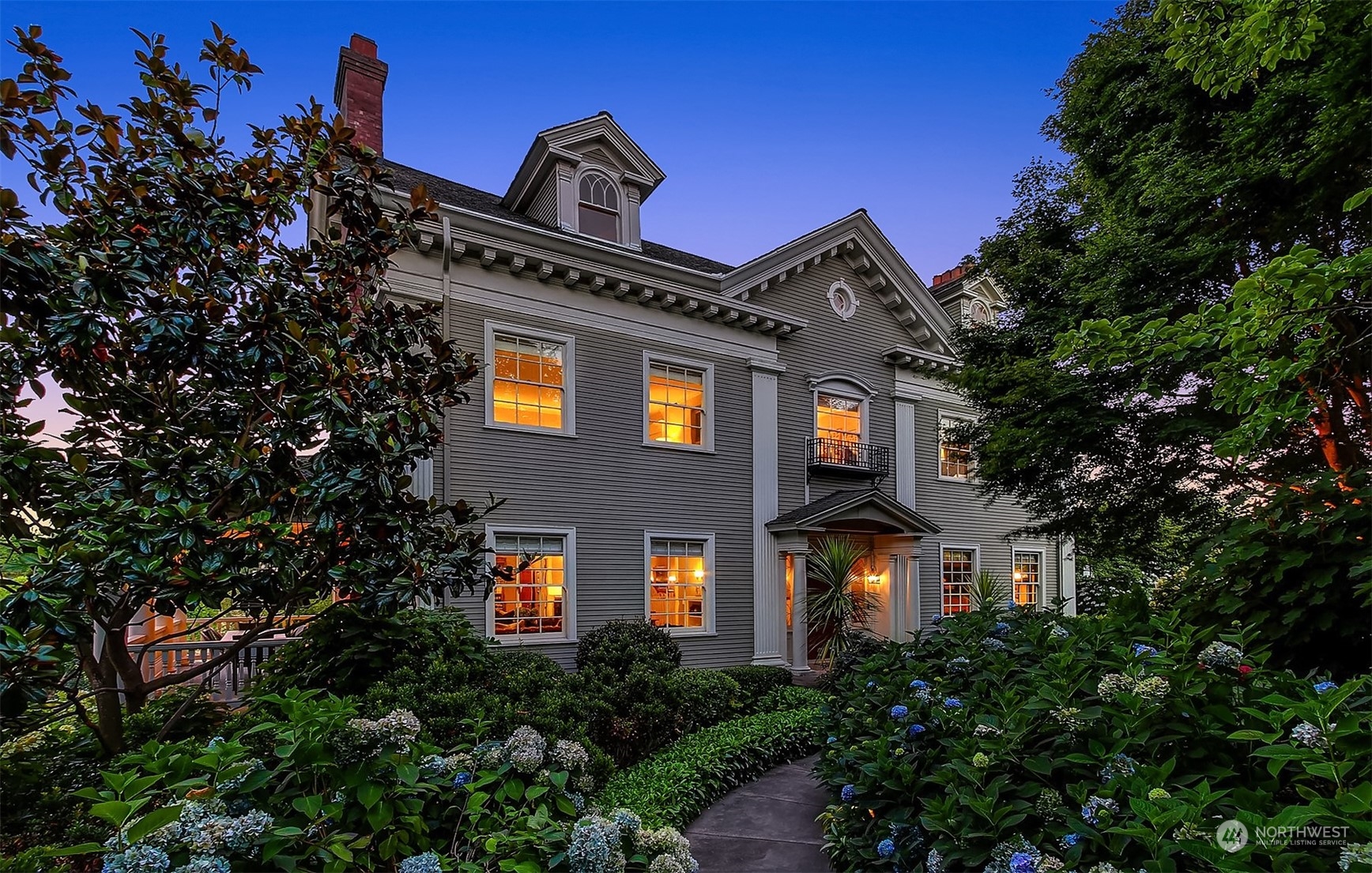 3708 42nd Avenue South Seattle, WA 98144 - Photo 38 of 40 a front view of a house with plants and trees