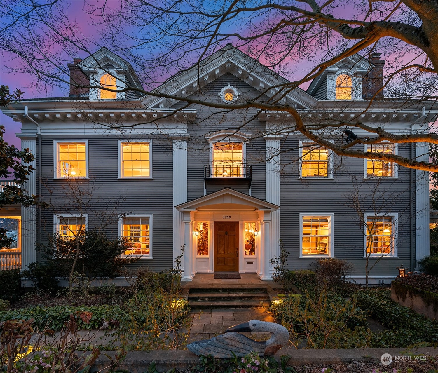 3708 42nd Avenue South Seattle, WA 98144 - Photo 5 of 40 a front view of a residential apartment building with a yard