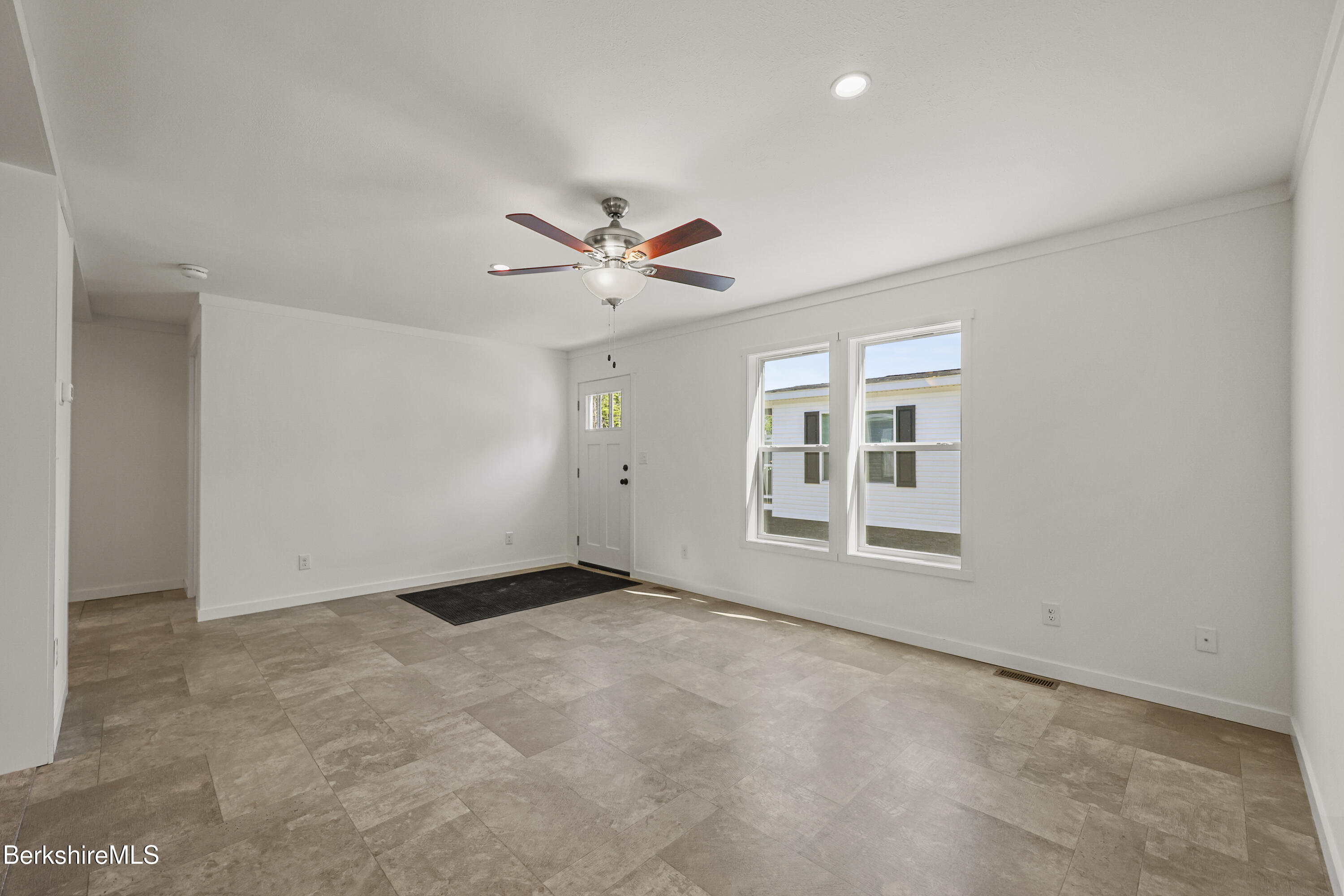 395 Cheshire Road, Unit 112 Pittsfield, MA 01201 - Photo 6 of 32 a view of an empty room with a window