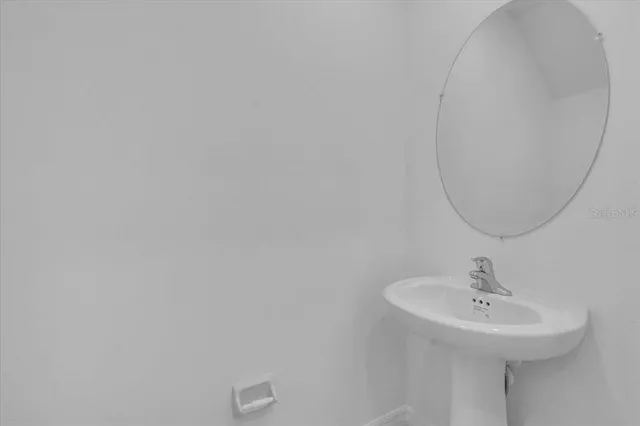 a sink with a mirror
