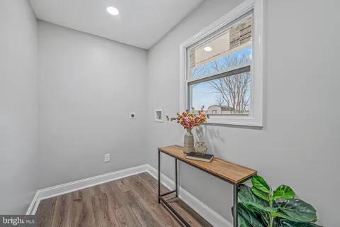 a view of room with a window and wooden floor