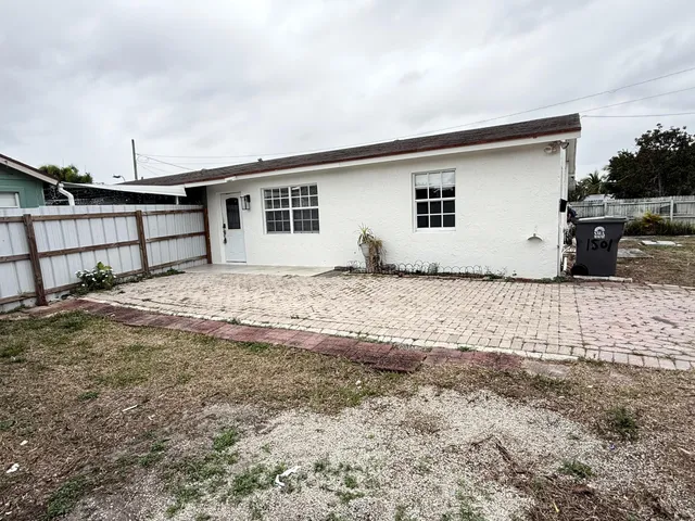 a house with trees in the background