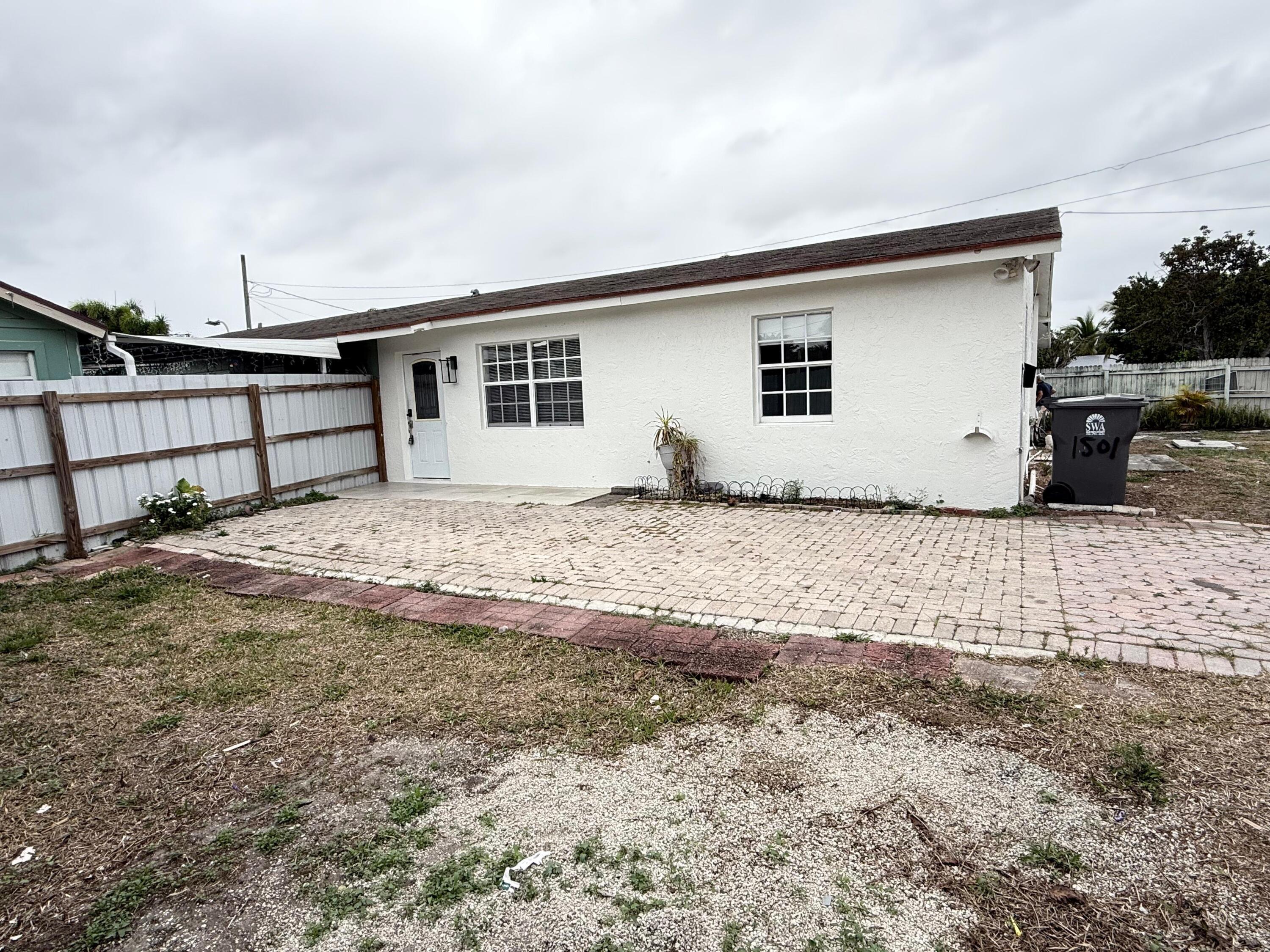 a house with trees in the background