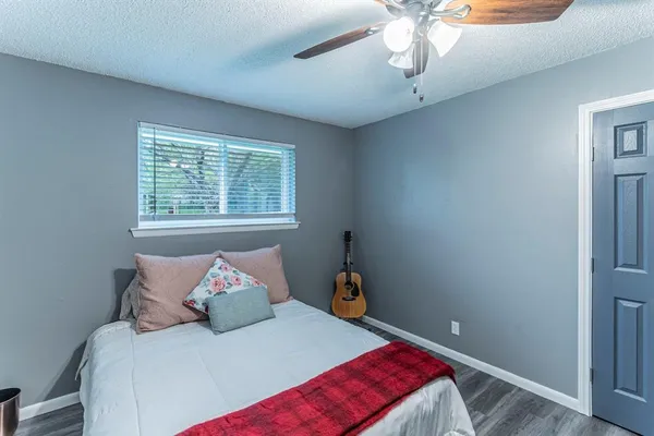 a bedroom with a bed and window