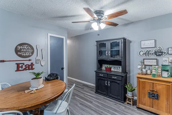 a view of a dining room with furniture and wooden floor