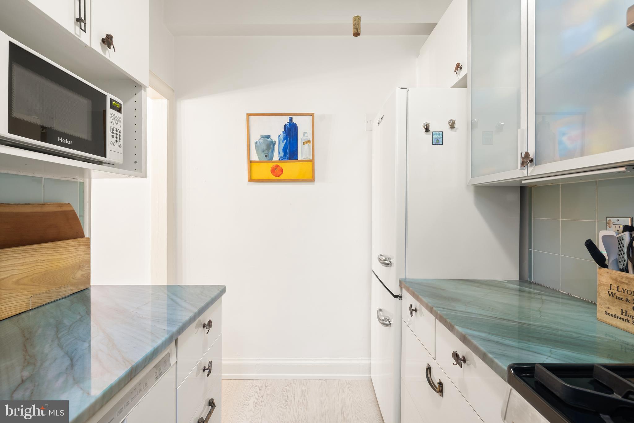 2032 Belmont Road Northwest, Unit 302 Washington, DC 20009 - Photo 21 of 31 Kitchen with Ample Cabinetry