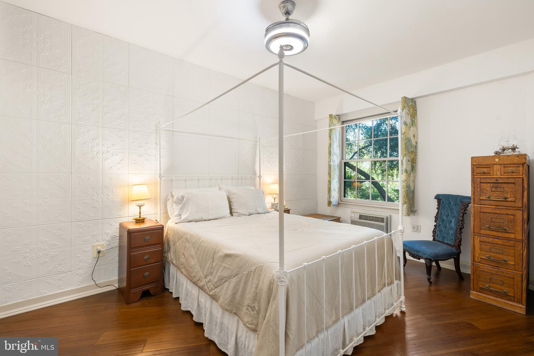 2032 Belmont Road Northwest, Unit 302 Washington, DC 20009 - Photo 23 of 31 Spacious Bedroom with Decorative Tile Wall