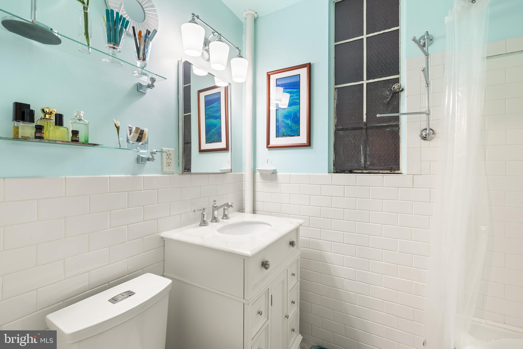2032 Belmont Road Northwest, Unit 302 Washington, DC 20009 - Photo 26 of 31 Hall Bath with New Vanity and Flooring
