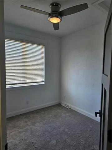 a view of a room that has a window