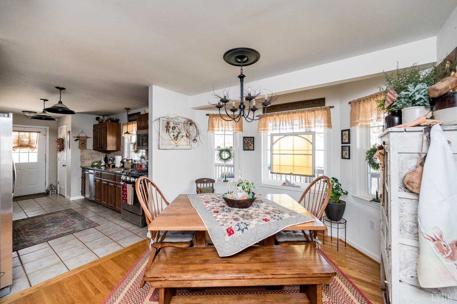 375 East Perch Road Monroe, VA 24574 - Photo 16 of 73 a living room with patio furniture and a chandelier