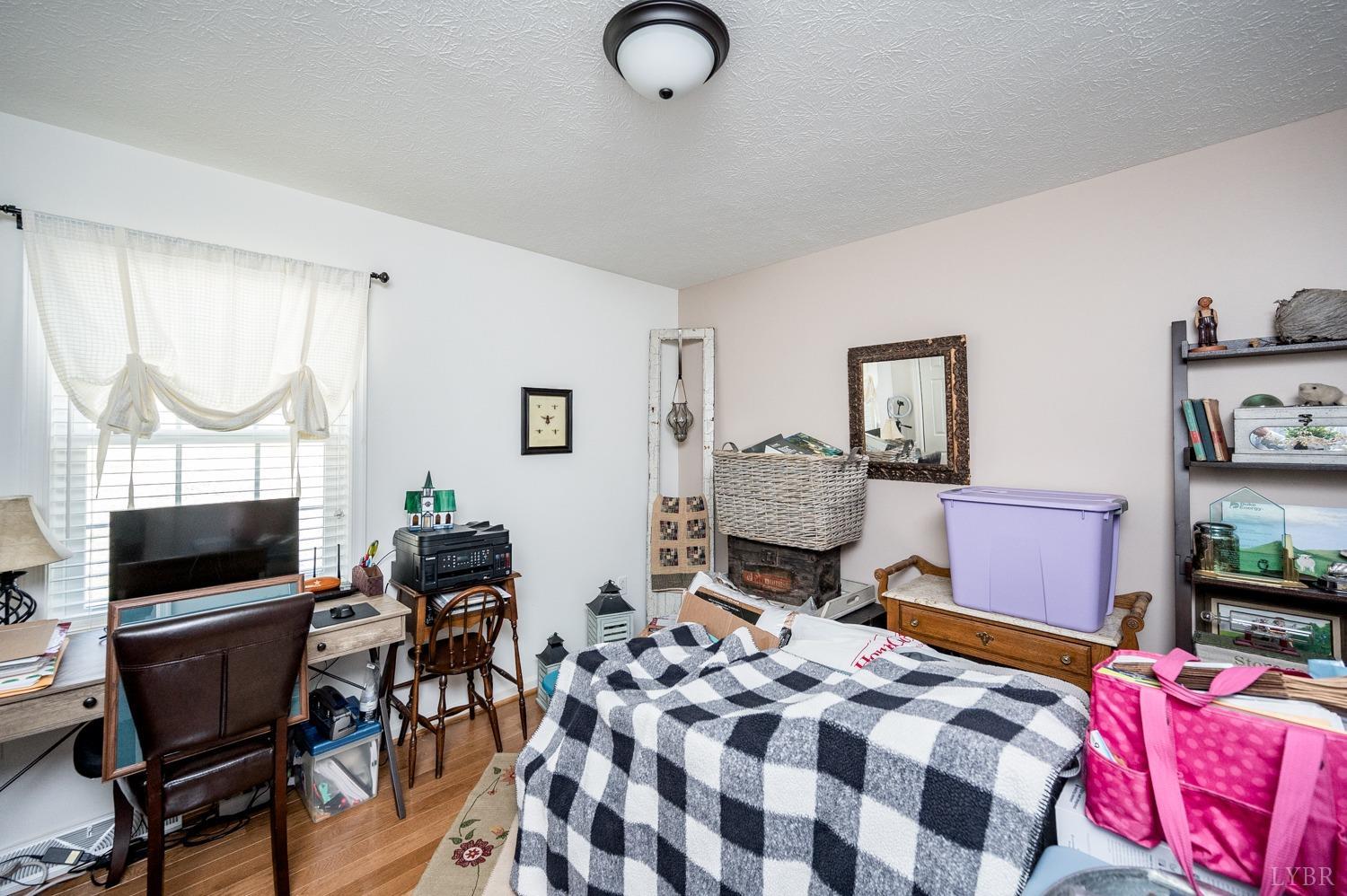375 East Perch Road Monroe, VA 24574 - Photo 22 of 73 a bedroom with furniture and a flat screen tv