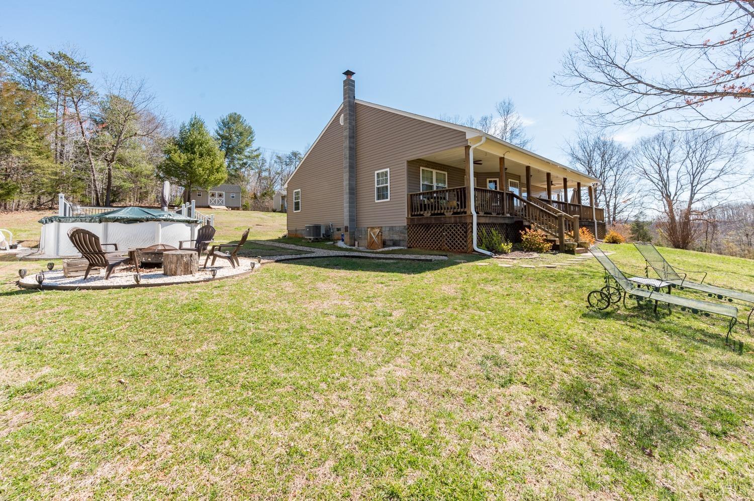 375 East Perch Road Monroe, VA 24574 - Photo 40 of 73 a view of a house with swimming pool and sitting area