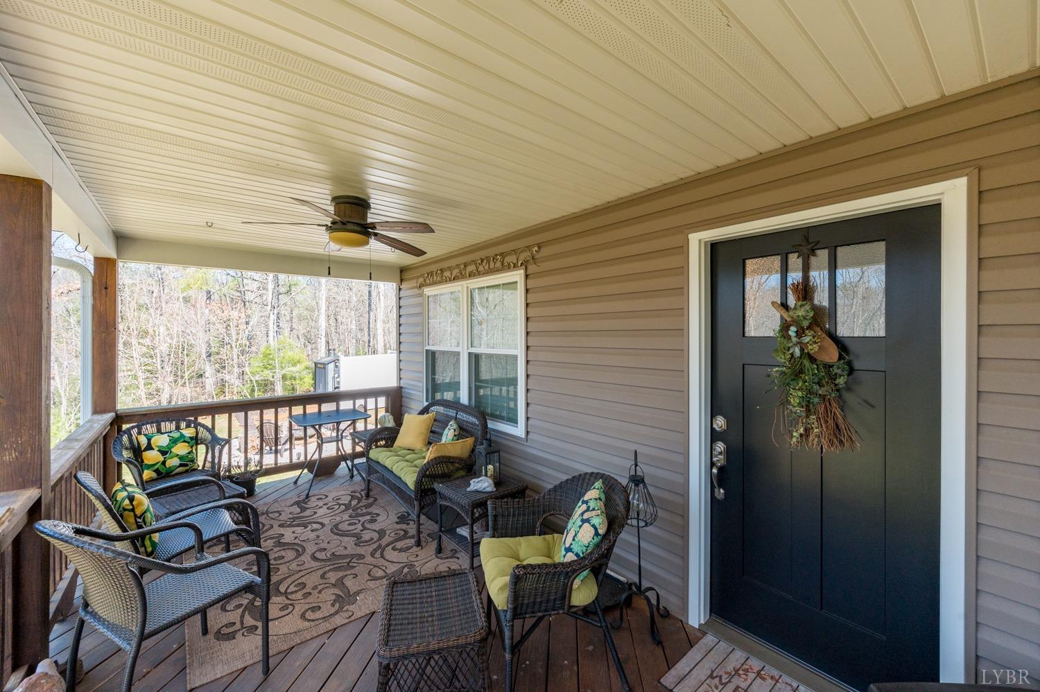 375 East Perch Road Monroe, VA 24574 - Photo 4 of 73 a view of a porch with furniture and front door