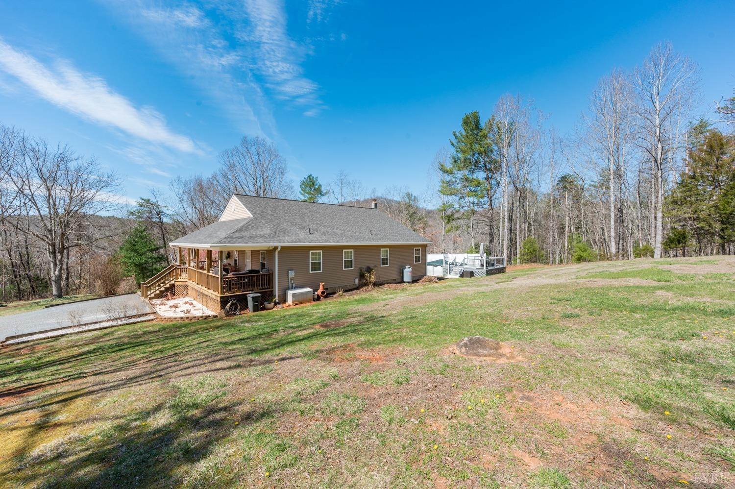 375 East Perch Road Monroe, VA 24574 - Photo 60 of 73 a view of a house with a big yard and large trees