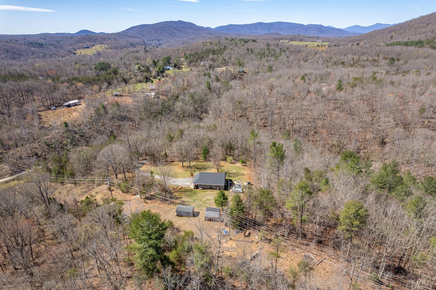 375 East Perch Road Monroe, VA 24574 - Photo 73 of 73 a view of a lush green hillside and a building