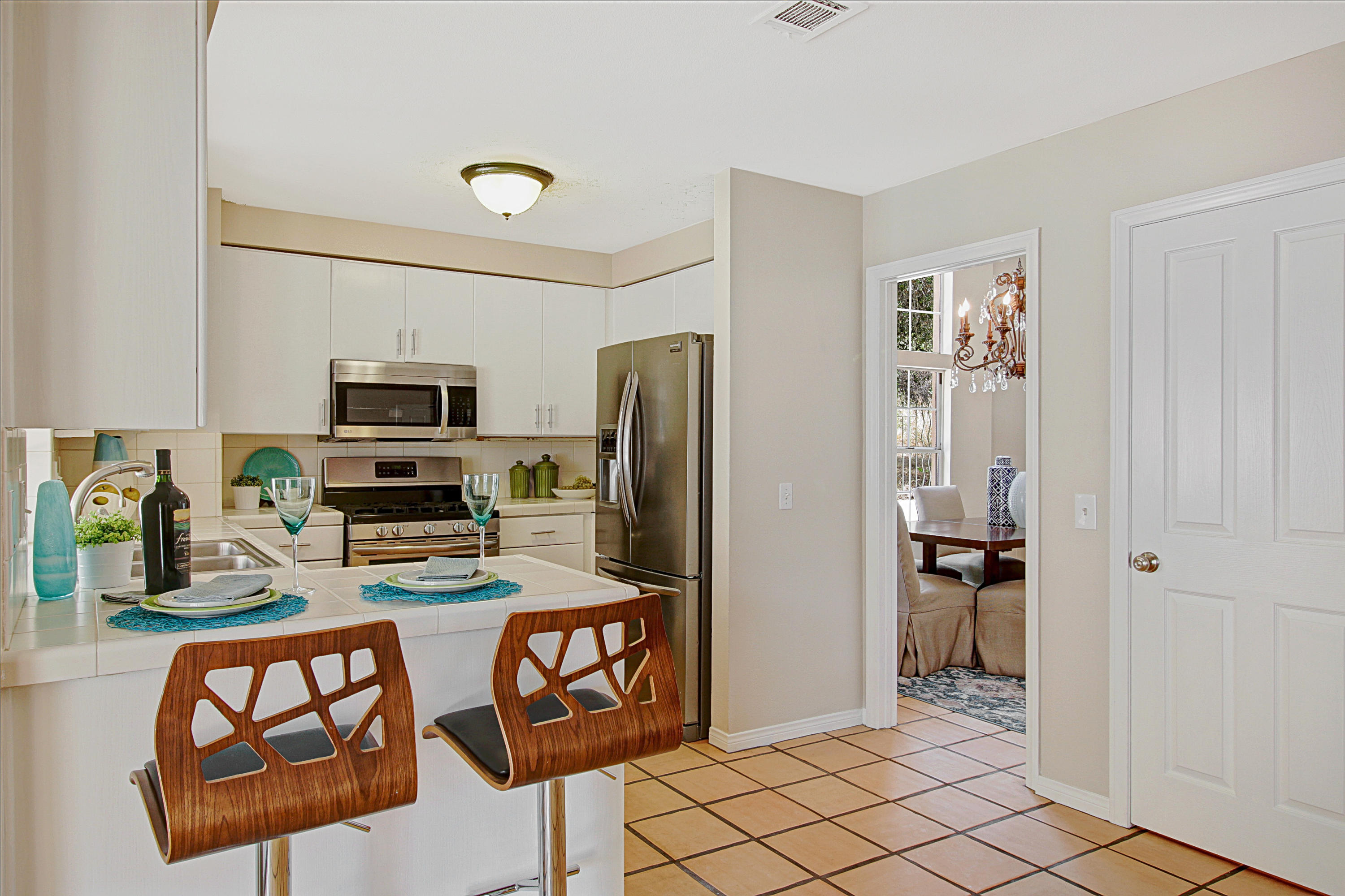 4008 Primavera Road Santa Barbara, CA 93110 - Photo 12 of 21 a kitchen with stainless steel appliances a refrigerator and microwave