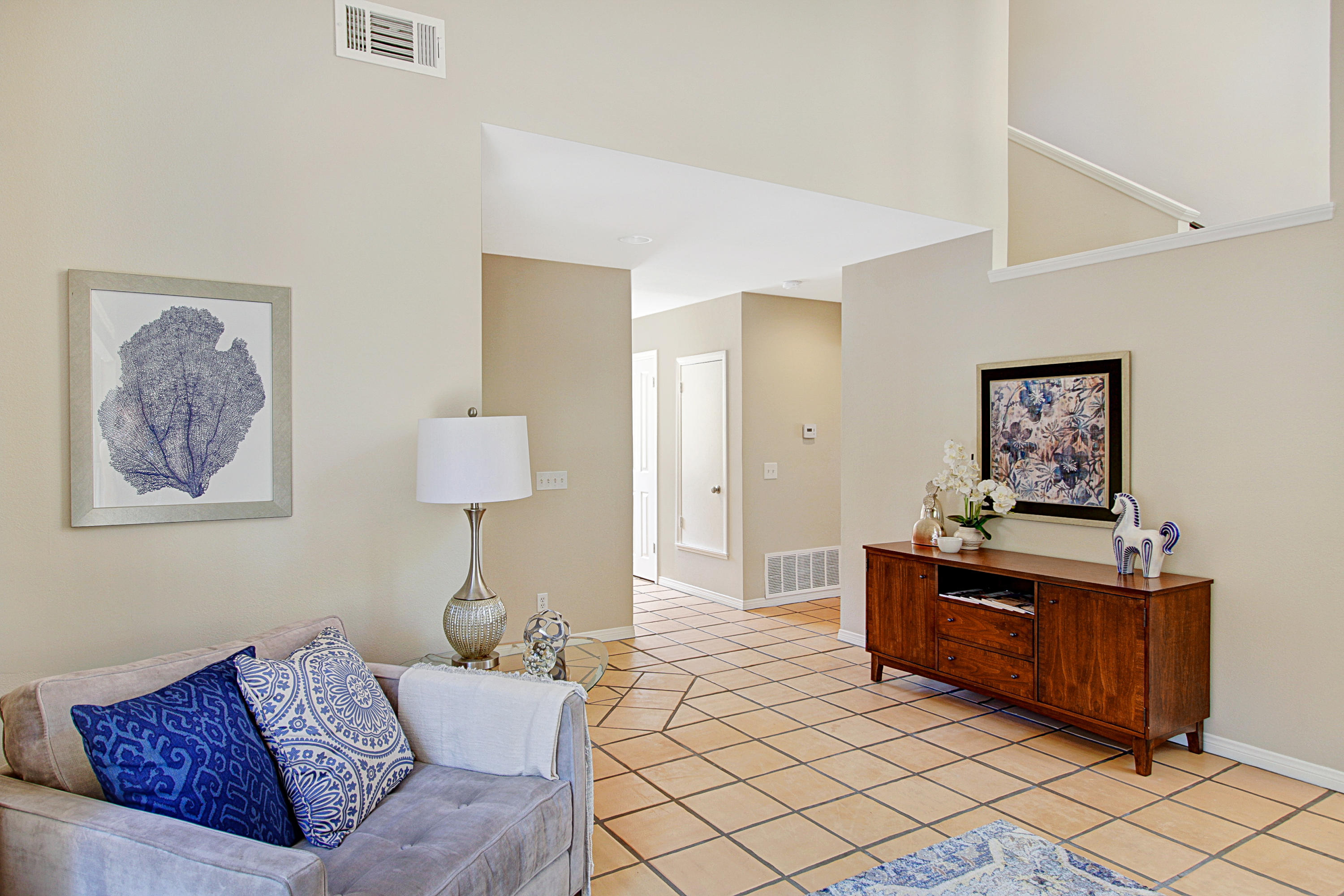 4008 Primavera Road Santa Barbara, CA 93110 - Photo 13 of 21 a living room with furniture and a lamp
