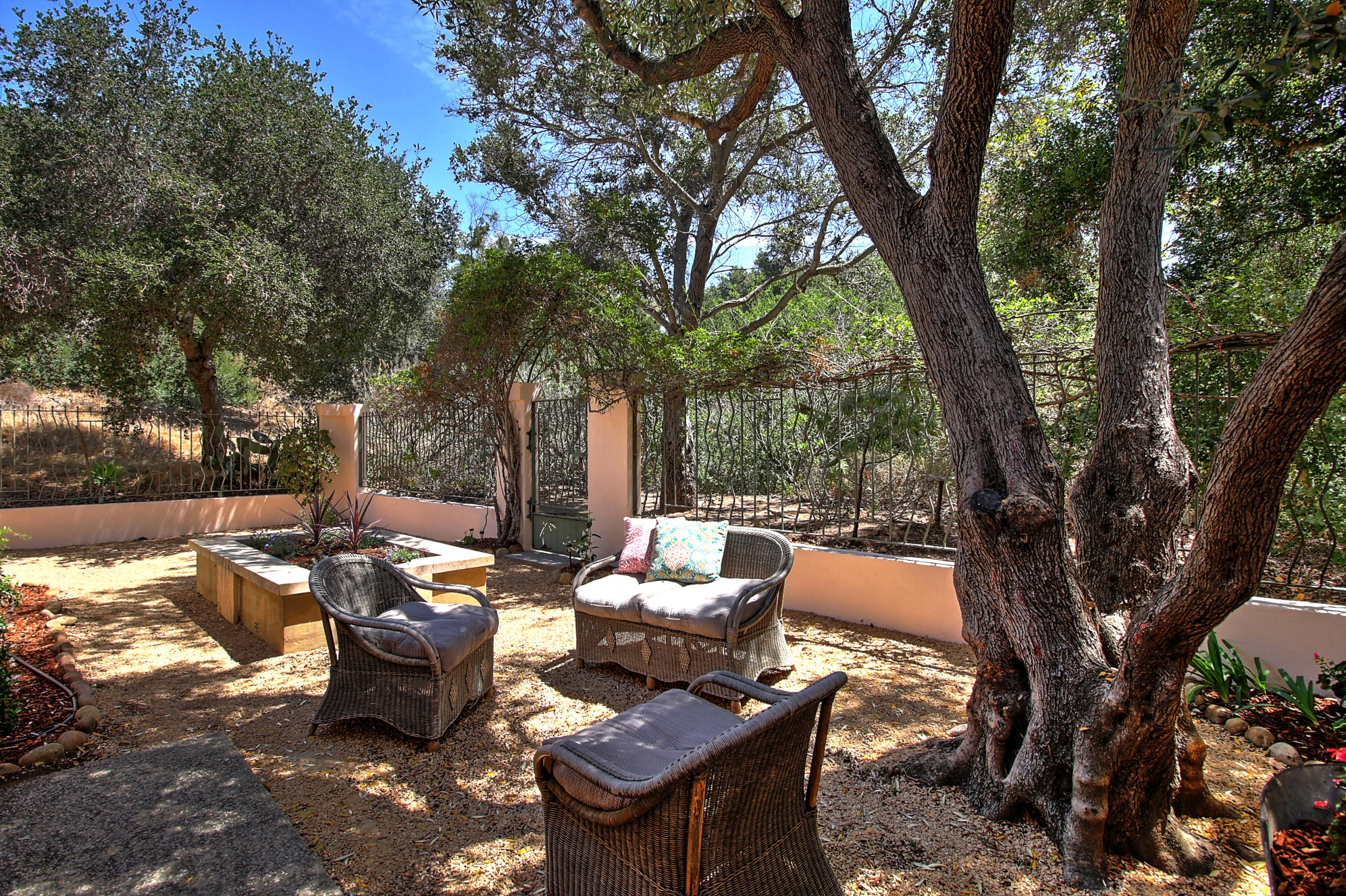 4008 Primavera Road Santa Barbara, CA 93110 - Photo 14 of 21 a backyard of a house with table and chairs