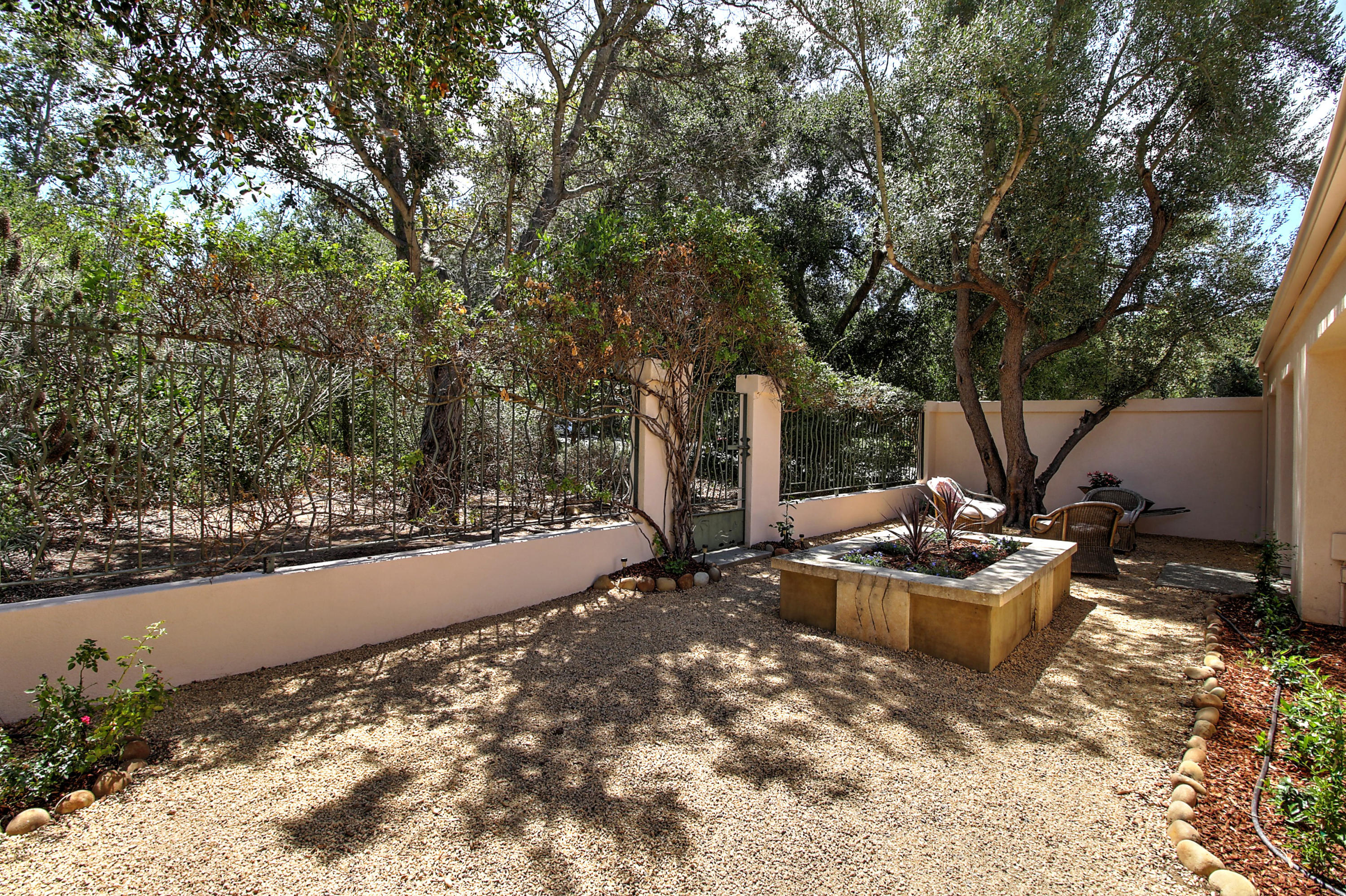 4008 Primavera Road Santa Barbara, CA 93110 - Photo 15 of 21 a view of a backyard with chair and tables