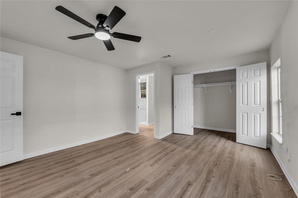 2524 McFerrin Avenue Waco, TX 76708 - Photo 16 of 29 an empty room with wooden floor and a ceiling fan