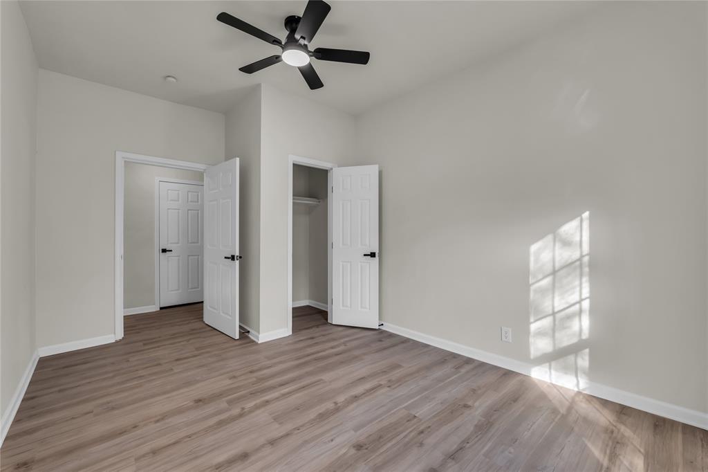 2524 McFerrin Avenue Waco, TX 76708 - Photo 24 of 29 an empty room with wooden floor and windows