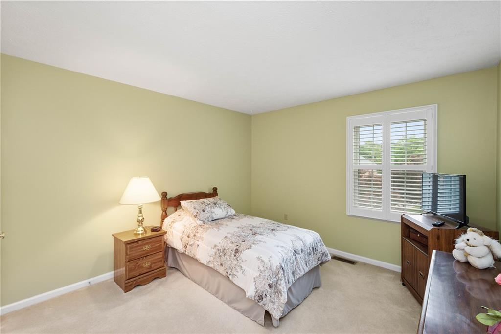 104 Camelot Circle Coraopolis, PA 15108 - Photo 26 of 33 a bedroom with a bed and a window