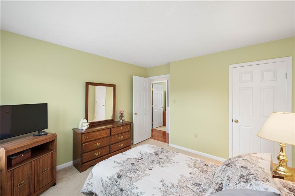 104 Camelot Circle Coraopolis, PA 15108 - Photo 27 of 33 a bedroom with a bed and flat screen tv