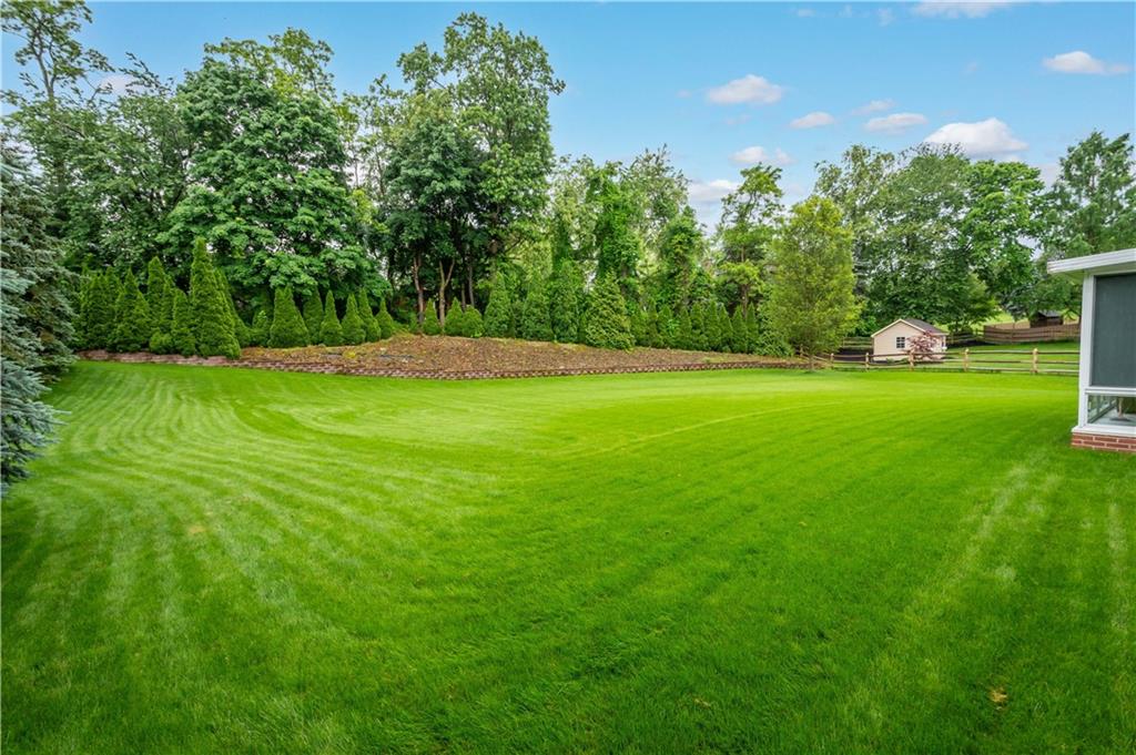 104 Camelot Circle Coraopolis, PA 15108 - Photo 29 of 33 a view of a big yard with plants and large trees