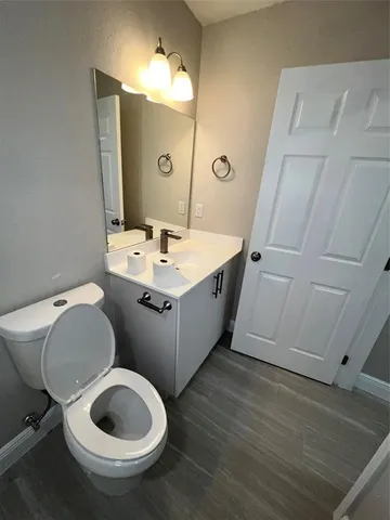 a bathroom with a sink a toilet and bathtub