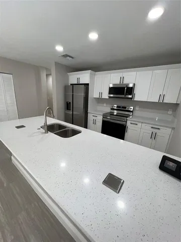 a view of a livingroom with furniture and wooden floor