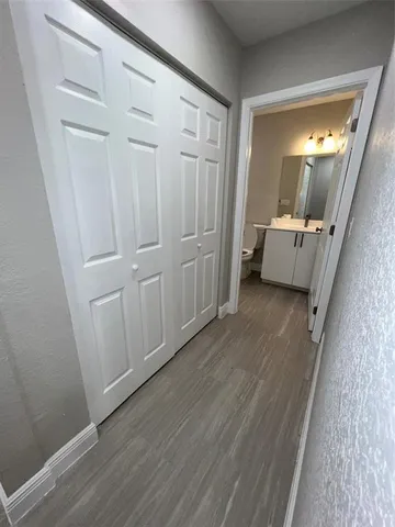 a utility room with cabinets washer and dryer