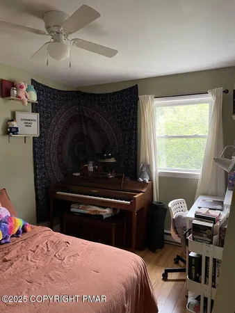 a bathroom with a toilet a sink and a window