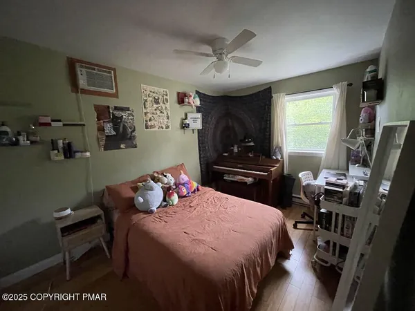 a bedroom with a bed and window