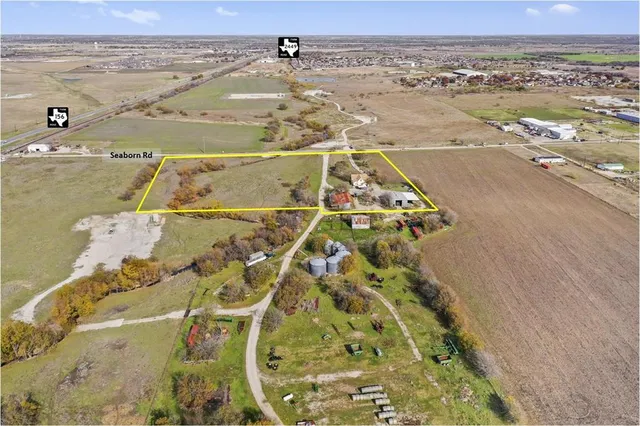 an aerial view of beach and ocean