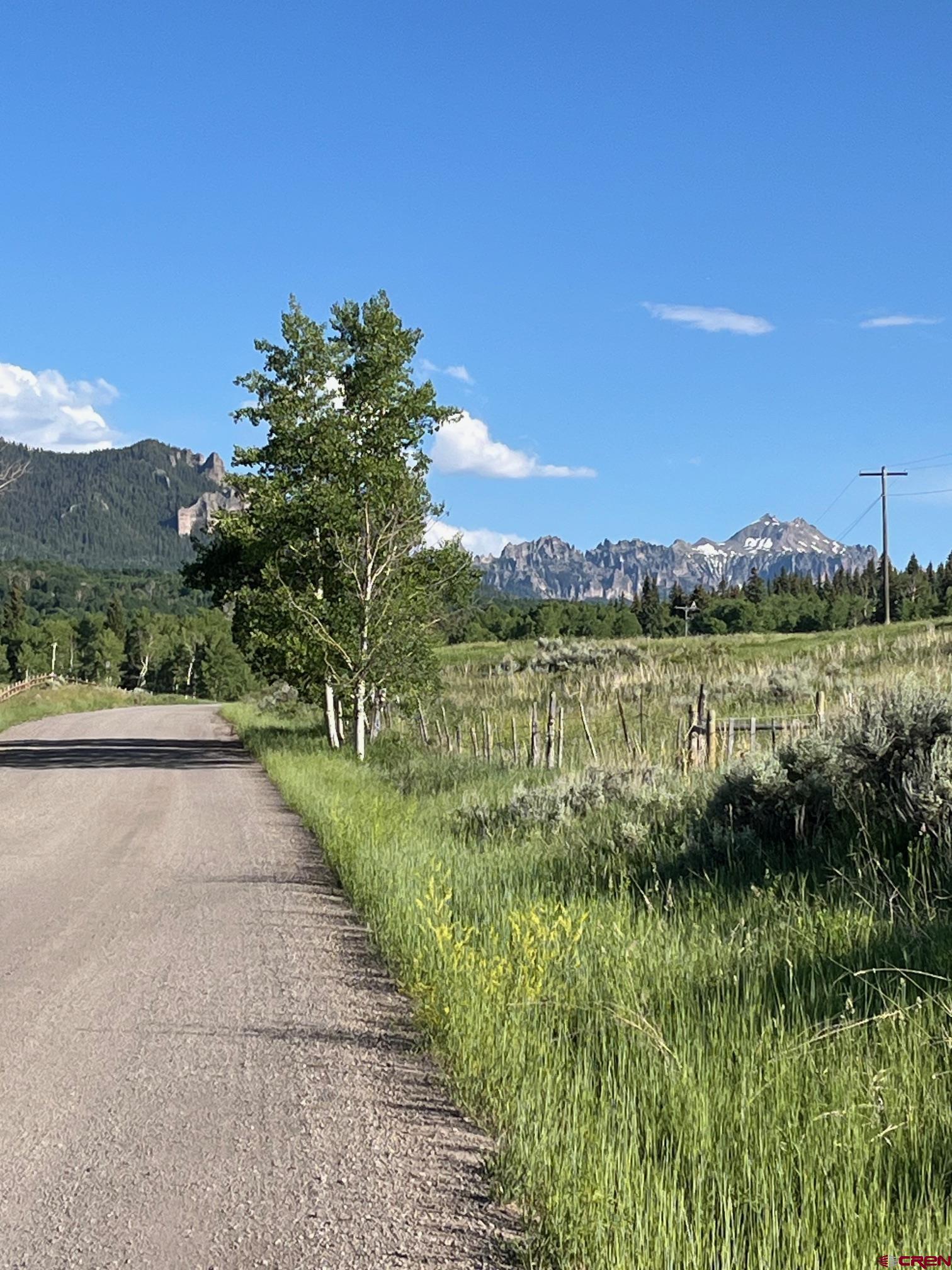 Tbd Eagles Rest Montrose, CO 81220 - Photo 6 of 8 a view of a lake with a big yard