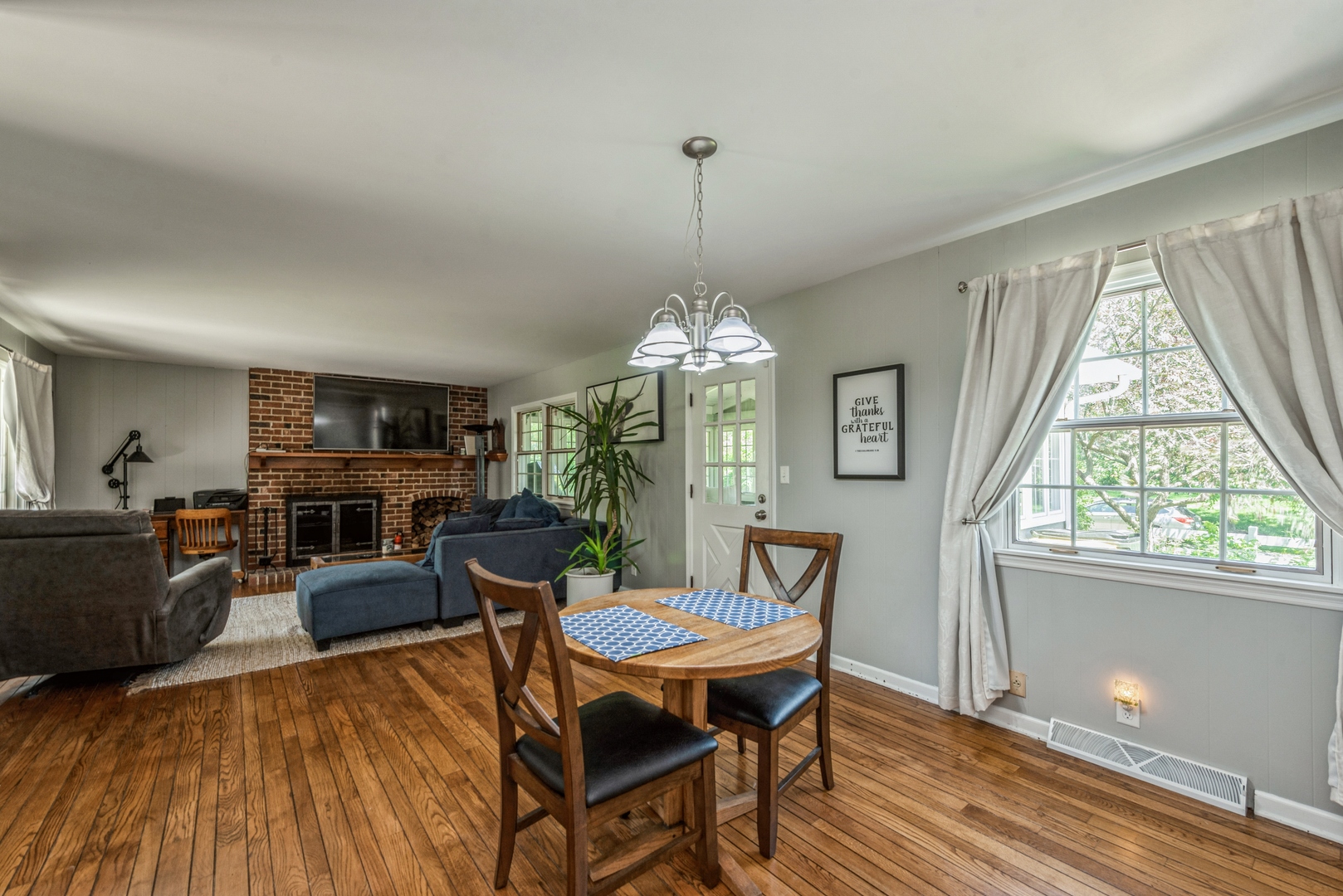 426 High Road Cary, IL 60013 - Photo 11 of 28 a view of a dining room with furniture window and wooden floor