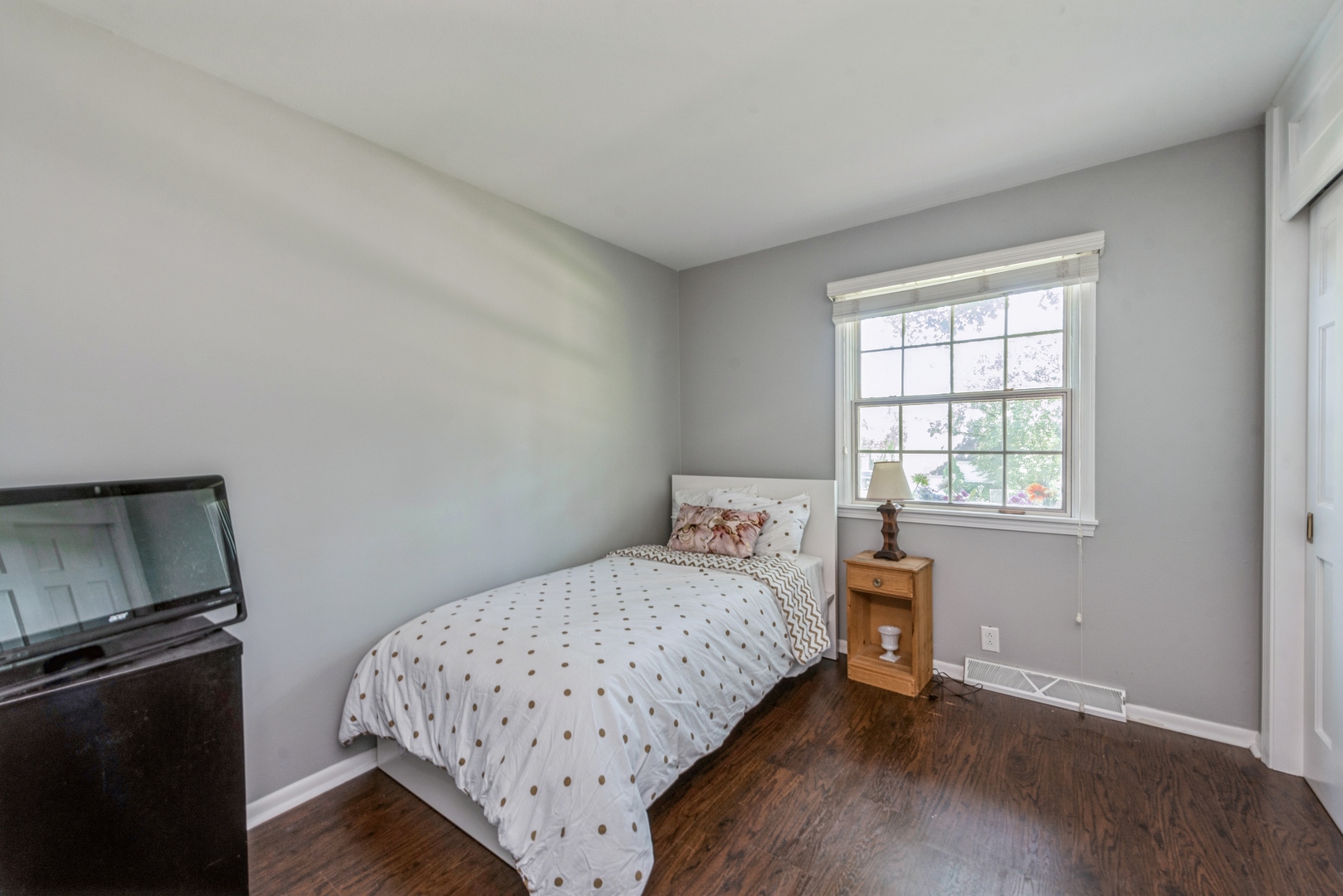 426 High Road Cary, IL 60013 - Photo 18 of 28 a bedroom with a bed and wooden floor