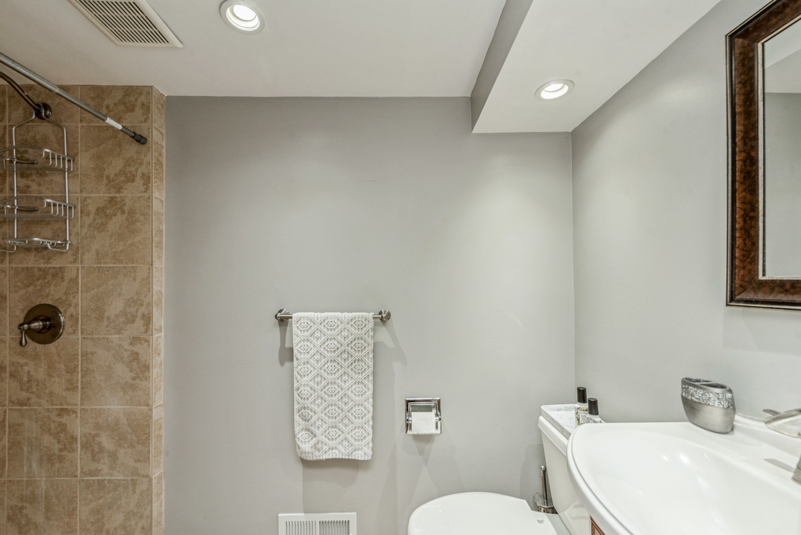 426 High Road Cary, IL 60013 - Photo 23 of 28 a bathroom with a toilet sink and shower