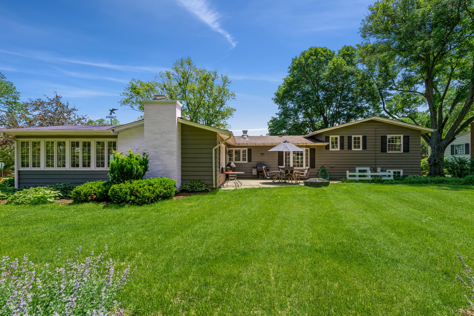 426 High Road Cary, IL 60013 - Photo 26 of 28 a front view of a house with a garden